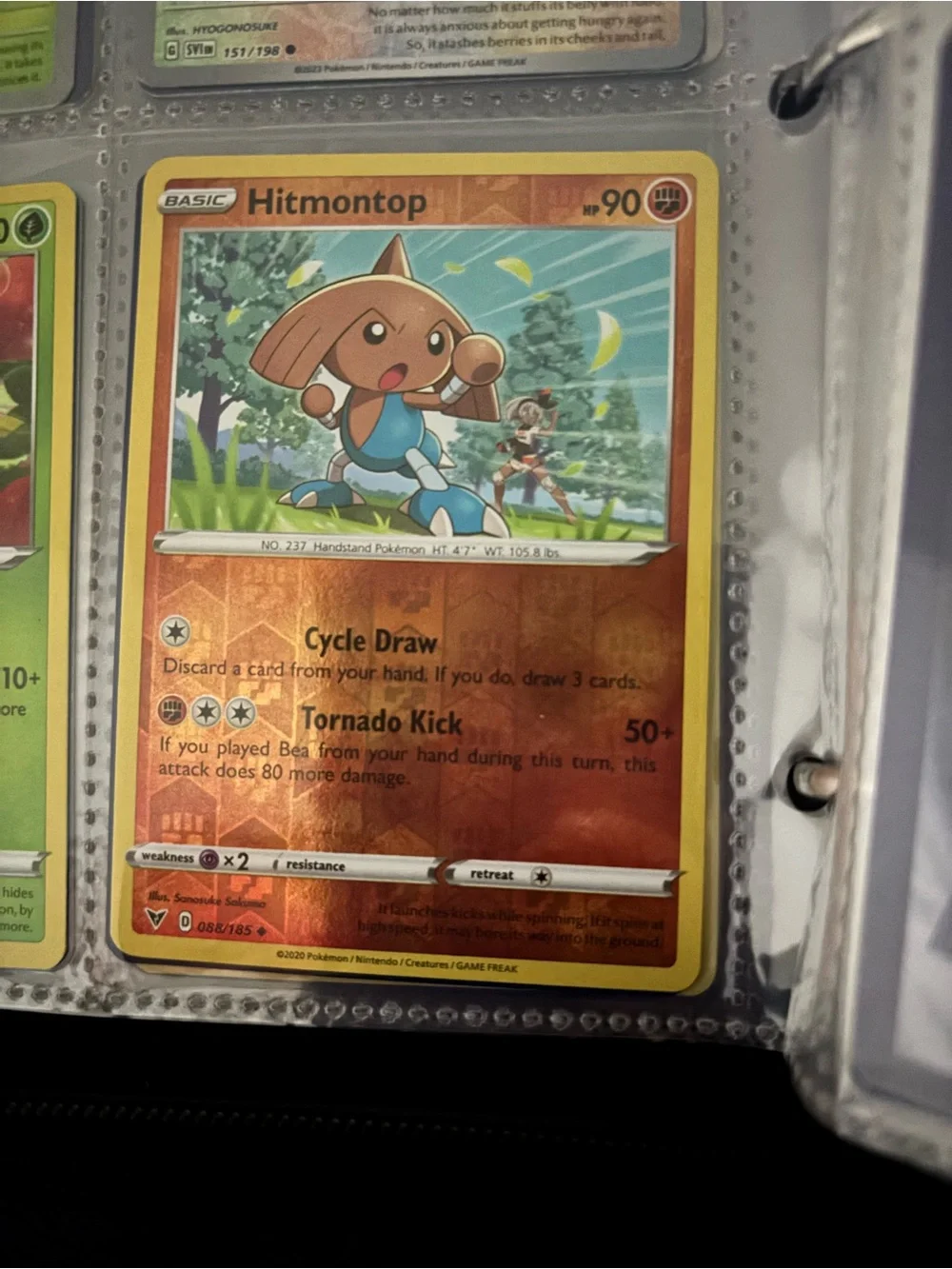 Pokemon Hitmontop Trading Card - Orange, Yellow, Blue
